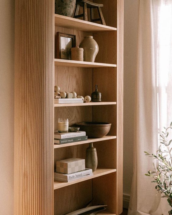 wooden bookshelf with decoratiions